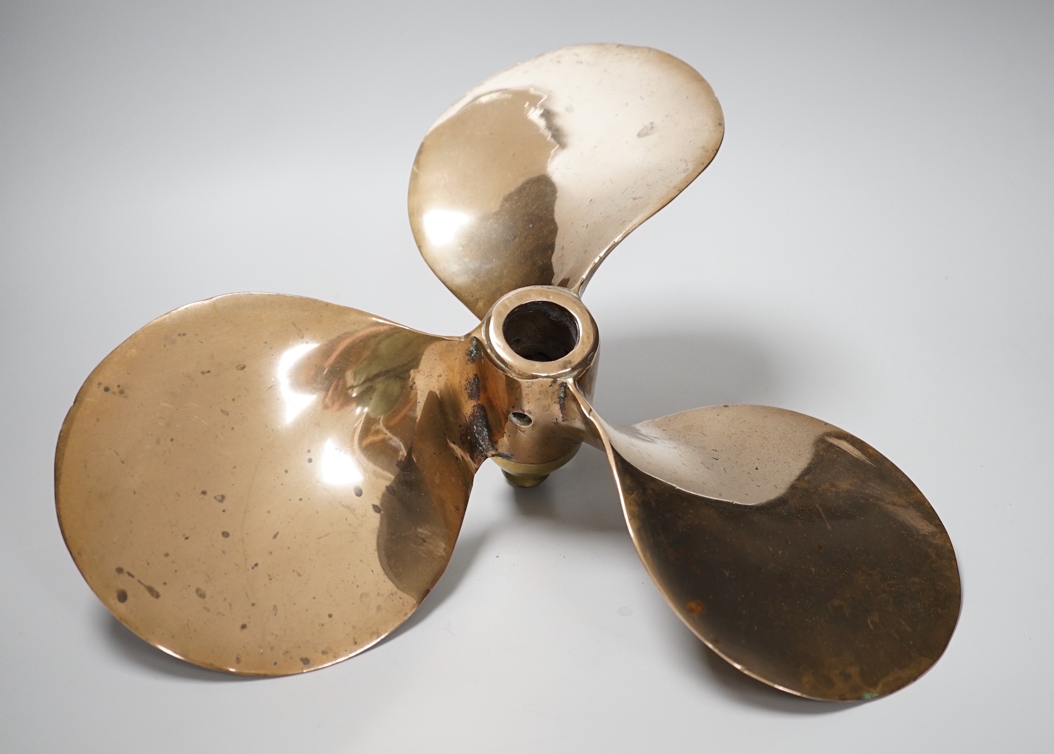 A lifeboat bronze propeller. 35cm diameter approx. salvaged from Chittagong ship yard between 1984-1989